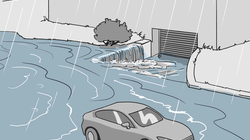 Bei Überschwemmungen fliesst Wasser oft von den Strassen und Garagenzufahrten auf das Gebäude zu. Überschwemmungssituation, wobei Wasser von der Strasse zum Gebäude zufliesst